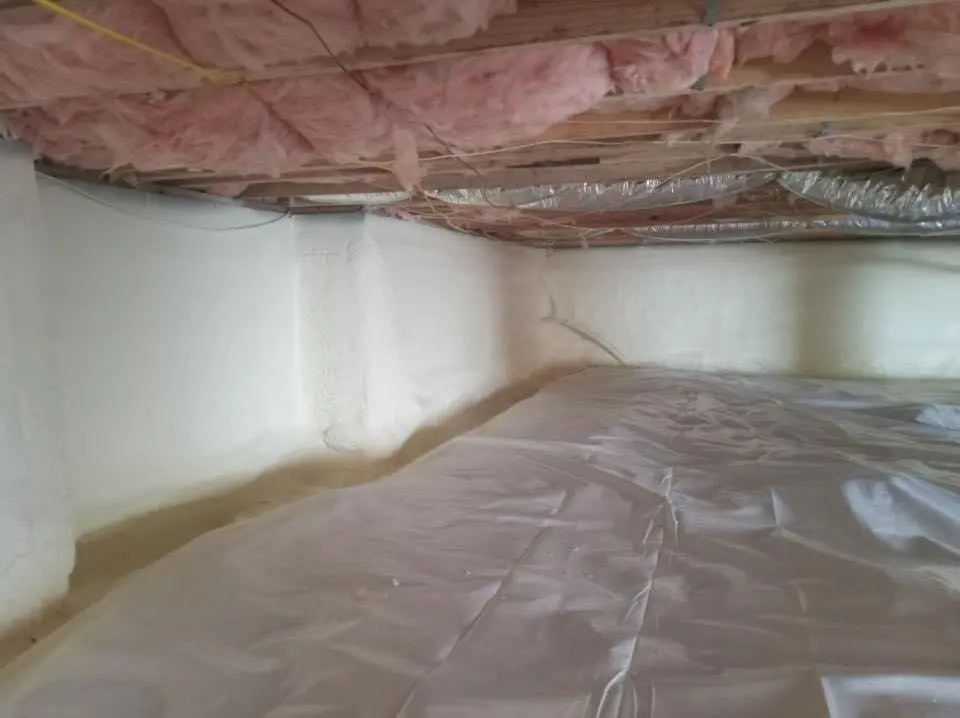 Crawl space encapsulation with closed-cell spray foam for Commercial Roof Restoration in Piqua
